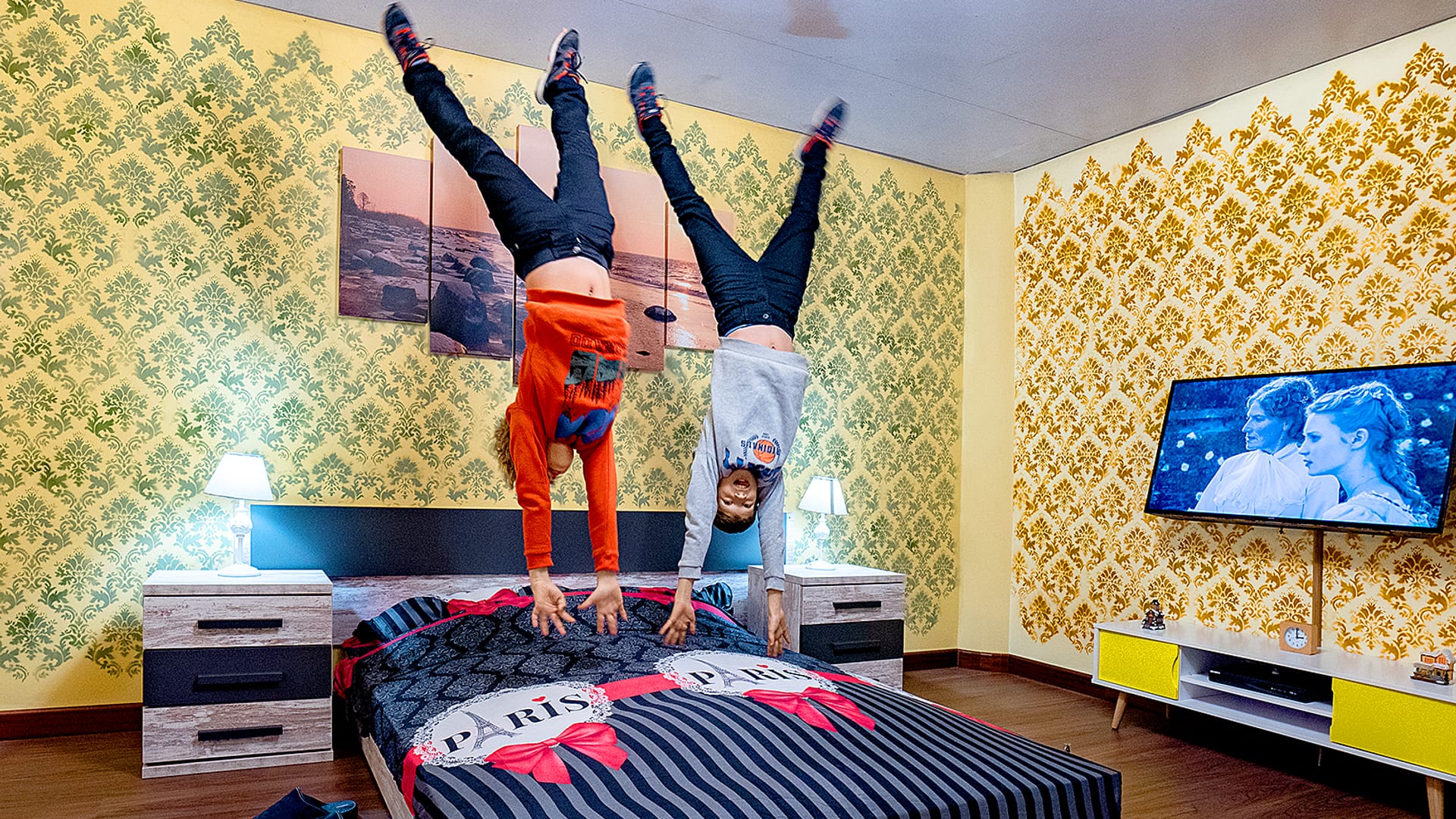 A visitor standing on the ceiling of an upside down living room, furniture above their head